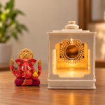 Hand Beside a Rainbow-Lit Ganesha Shrine